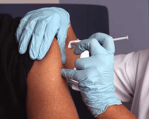 A clinician administering an injection